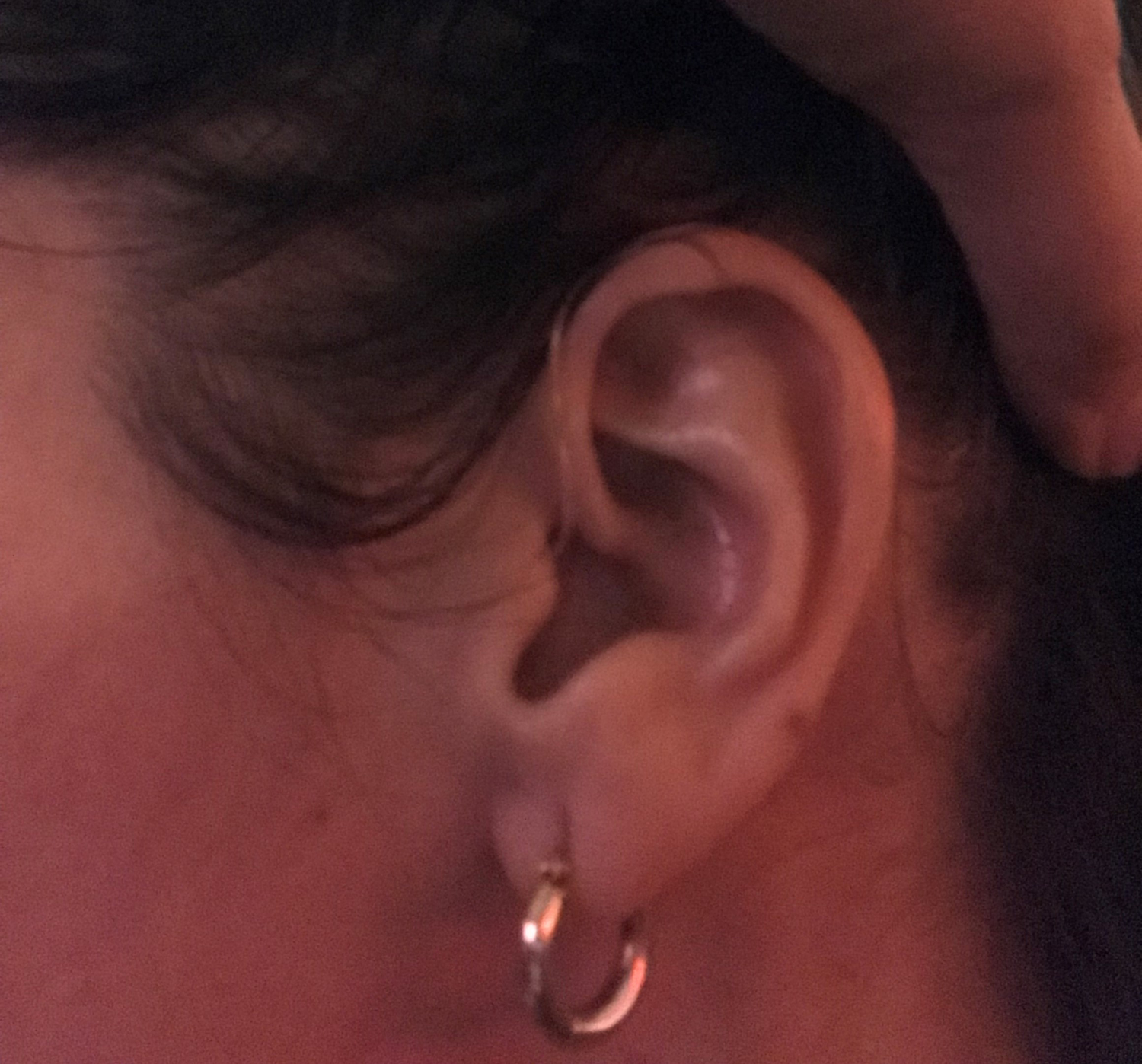 Close-up of my left ear with my new hearing aids. You can barely see a wire coming out of my ear canal and making its way behind my ear.